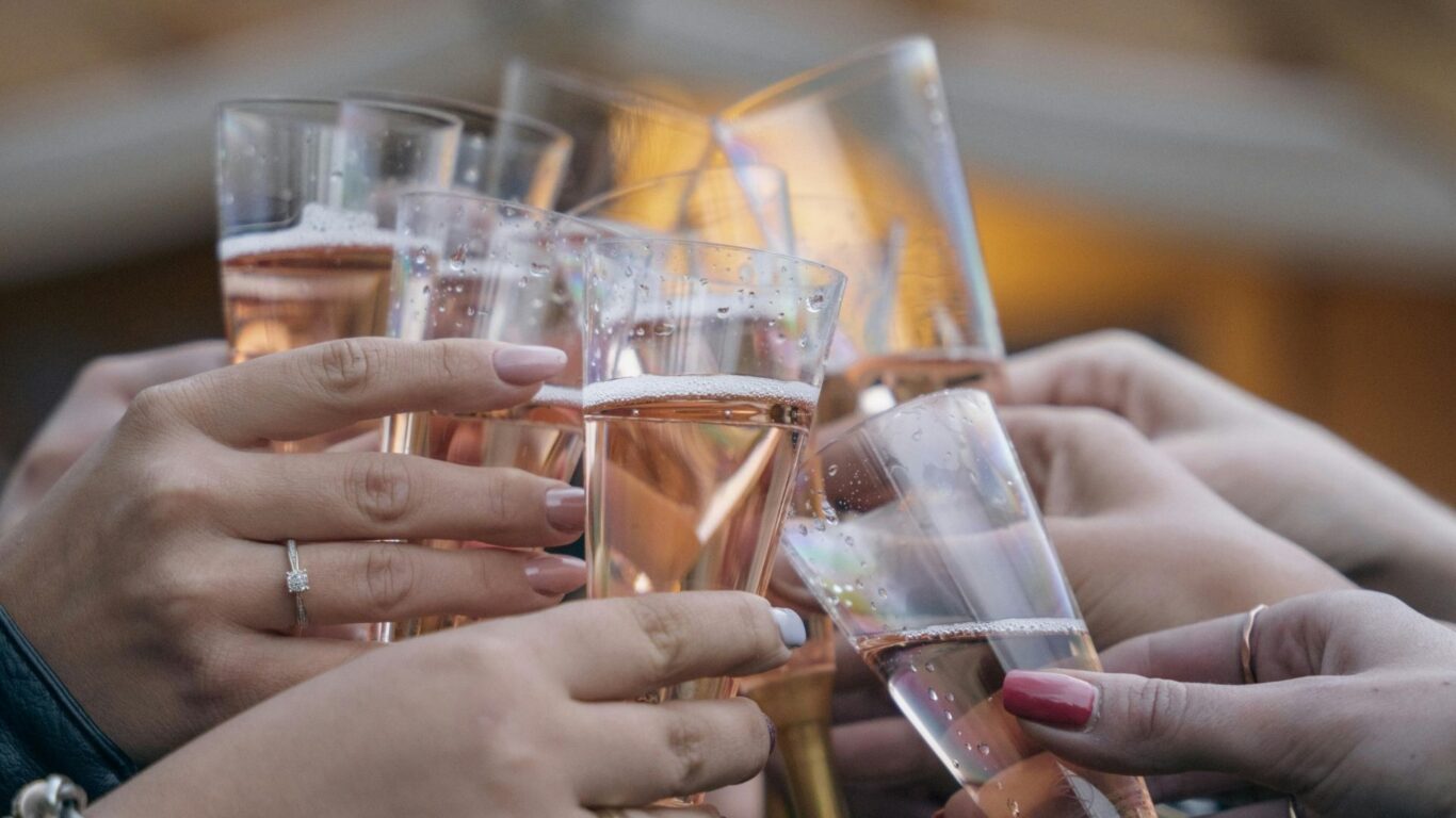 Guests toasting with champagne, enjoying a celebratory moment at our hotel's elegant dining area.